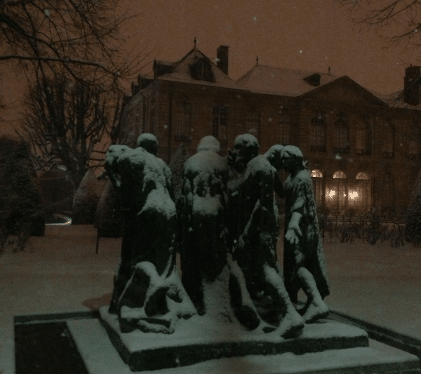 Snow covered sculpture in Paris at night