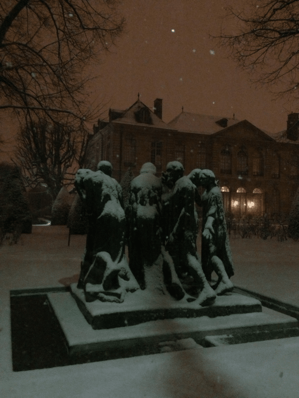 Snow covered sculpture in Paris at night