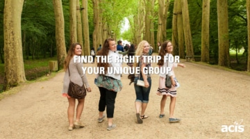 students walking in a woooded park