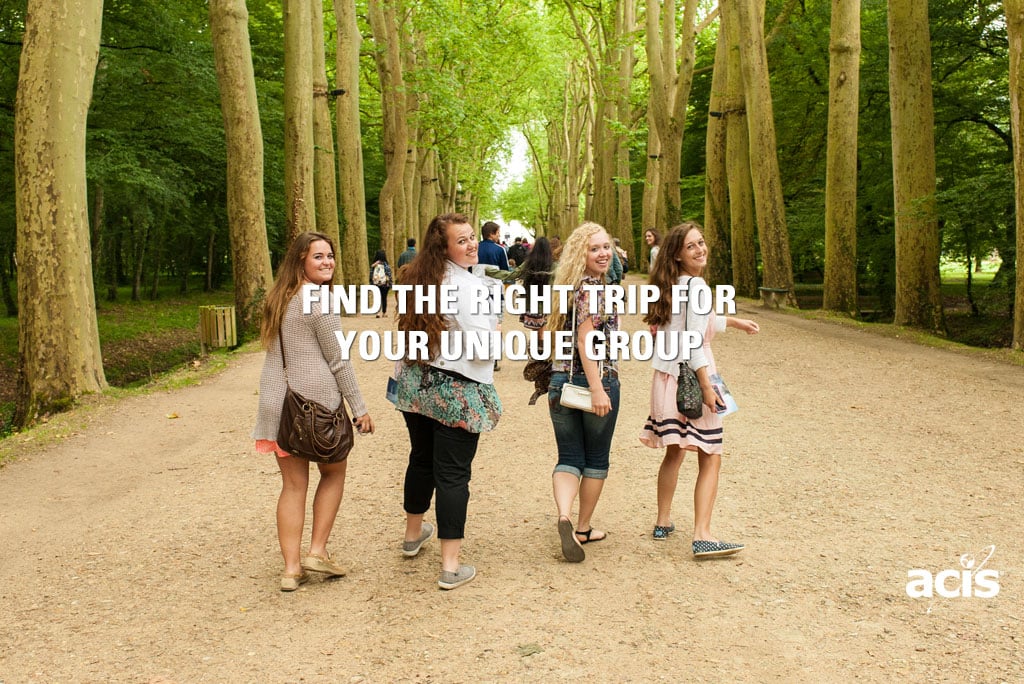 students walking in a woooded park