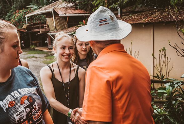 Student shaking hands with a local Costa Rica tour guide
