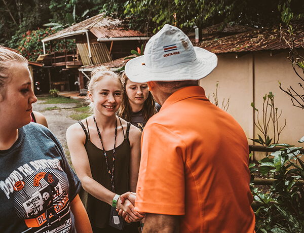 Student shaking hands with a local Costa Rica tour guide