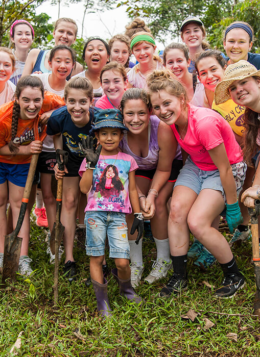 A Service Learning group posing together after planting trees in Costa Rica