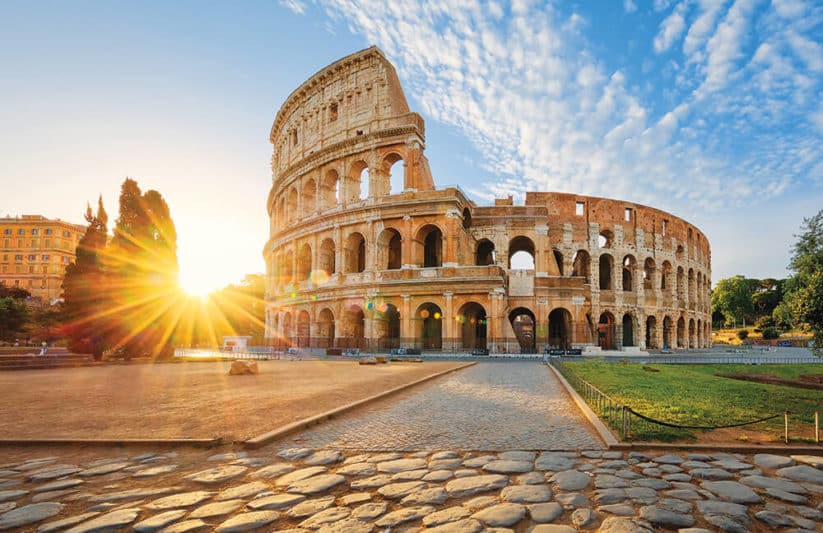 View of Rome Colosseum with sun shining behind