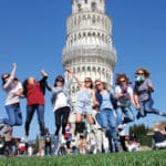 Group jumping in front of the Tower of Pisa