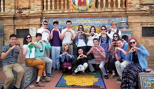 ACIS group making hearts with their hands in Seville