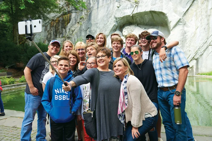 ACIS group posing in front of the Lion of Lucerne