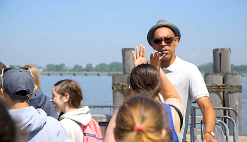 Students high-fiving a tour guide