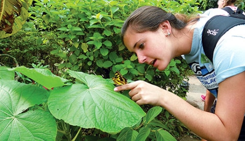 Student in Costa Rica with Butterfly