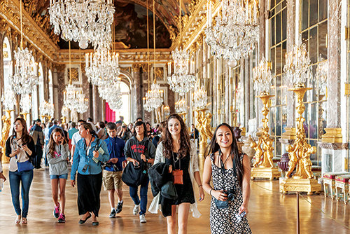 ACIS participants walking through Versailles