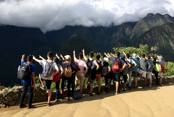 Group in Peru pointing towards the distance