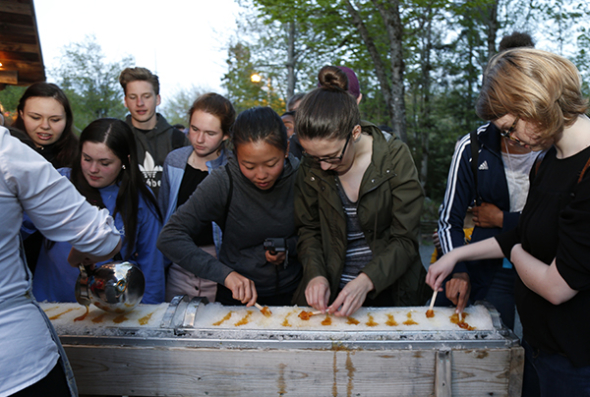 Students enjoying fresh maple syrup treats
