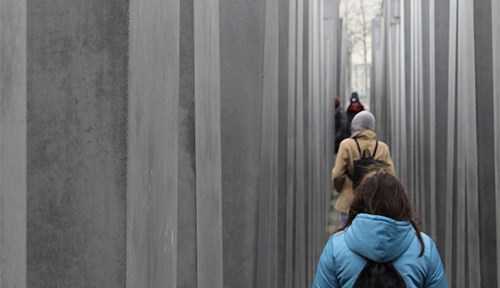 Students walk through the Berlin Holocaust Memorial
