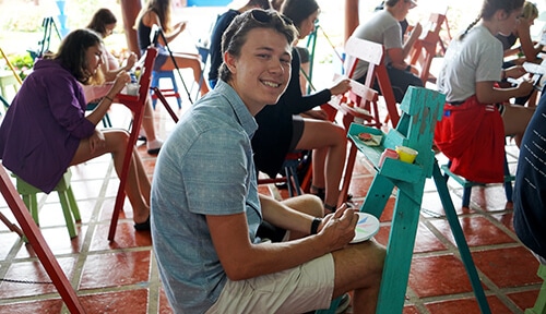 Students painting on easels in Costa Rica