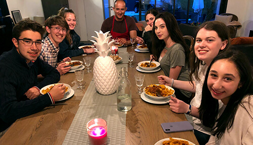 Students enjoy a local home cooked meal