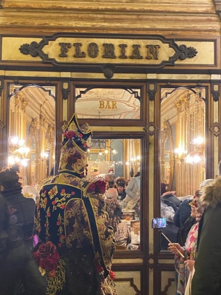 Carnevale attendee in an ornate disguise