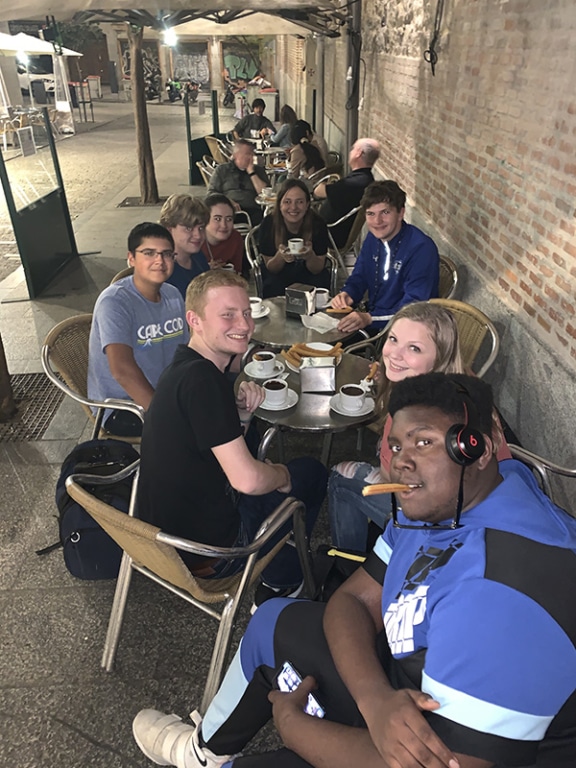 Tim's group enjoying churros and chocolate in Madrid