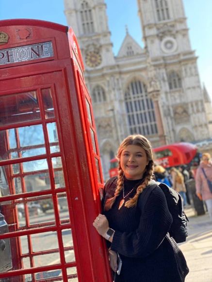A participant poses with a London phone booth