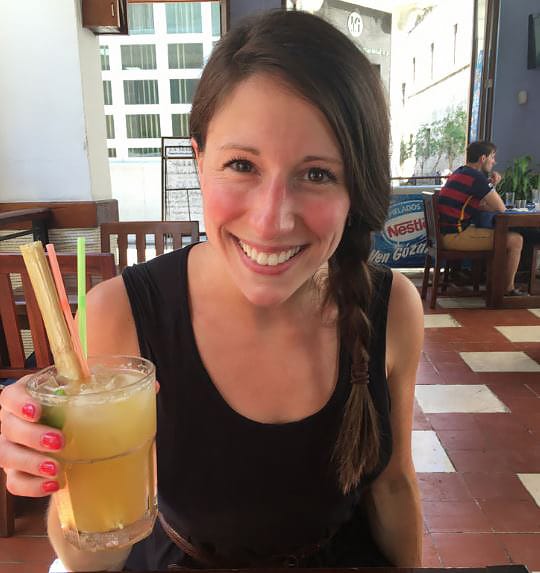 Jill with sugar cane juice from Cuba