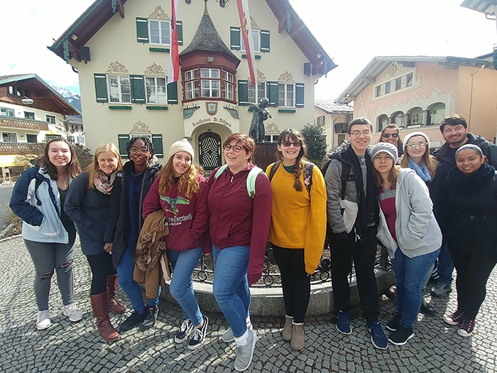 A group poses near St Gilgen's town hall