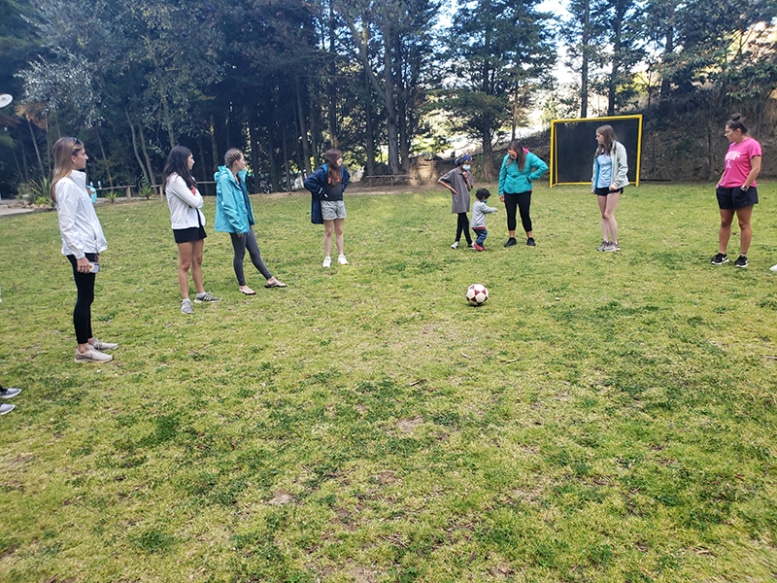 ACIS student travelers playing soccer in Ecuador
