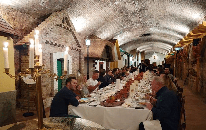 Group sitting down for a Thanksgiving meal in Budapest