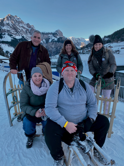 ACIS teachers getting ready for a toboggan ride in the Alps