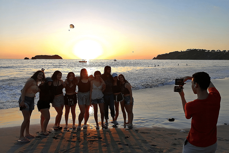 Student Travel Group on Manuel Antonio beach at sunset