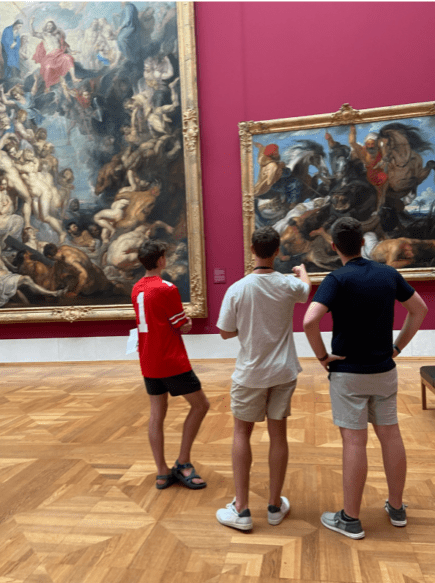 Three Students appreciating art in a museum