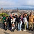 A group of students posing in front of the Florence cityscape
