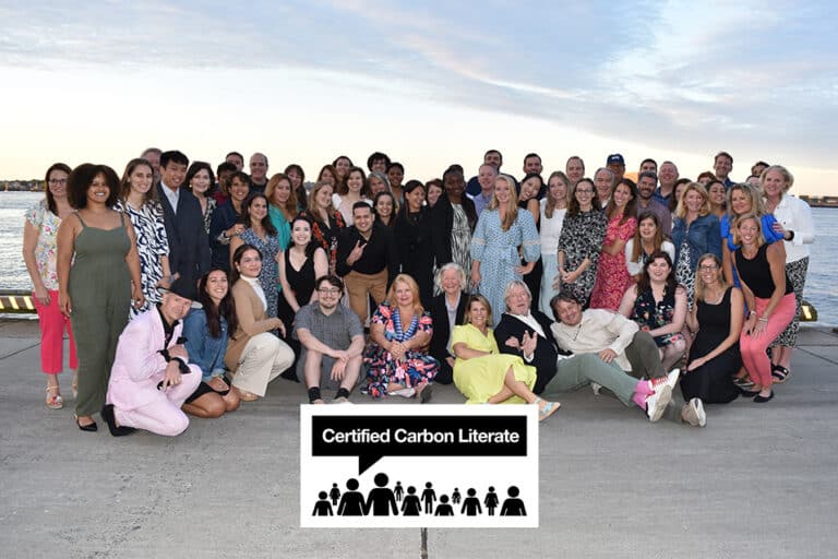 ACIS Company photo with Certified Carbon Literate badge