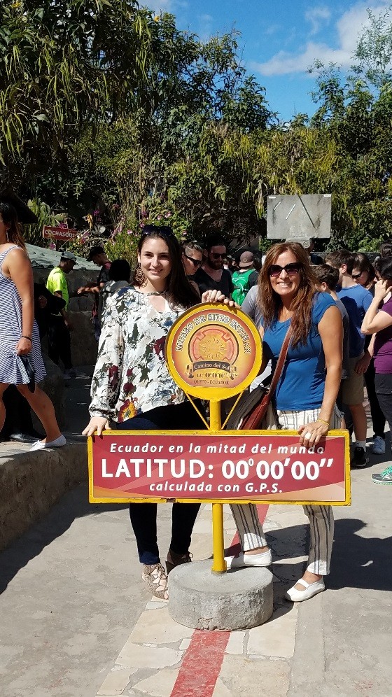 Two group leaders pose at the equator in Ecuador