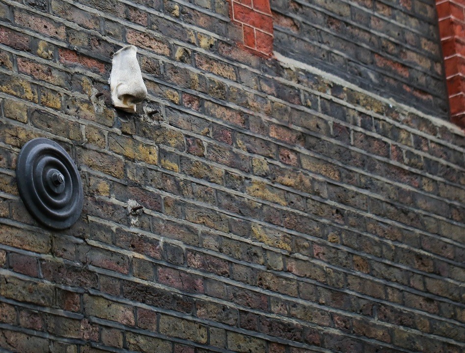 One of the seven "Noses of SoHo", a plaster cast of a nose affixed to a wall