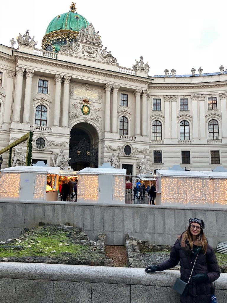 Traveler posed near Hofburg palace during the winter markets