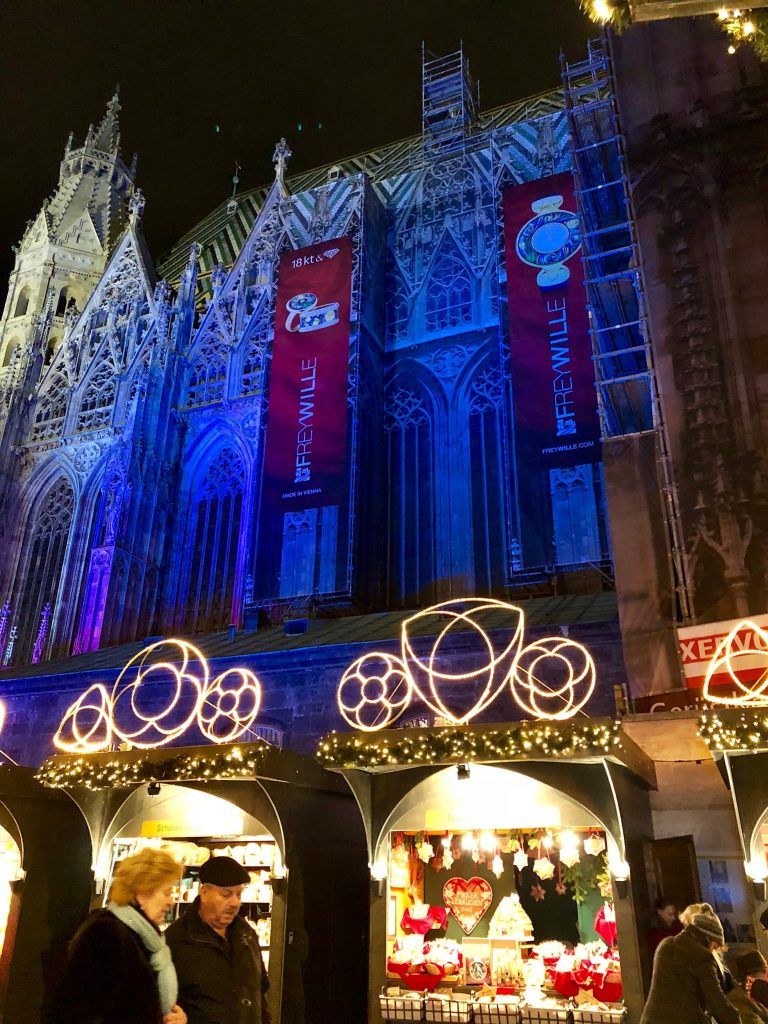 A closer look of the side of Stephens Cathedral and Christmas market stalls below.